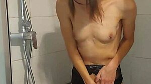 Petite teen girl strips down and has multiple orgasms in the shower