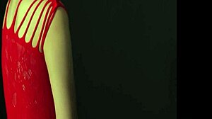 En fantastisk kvinne med sjarmerende bryster lokker deg i en provoserende positur mens du har på deg en forførende rød kjole